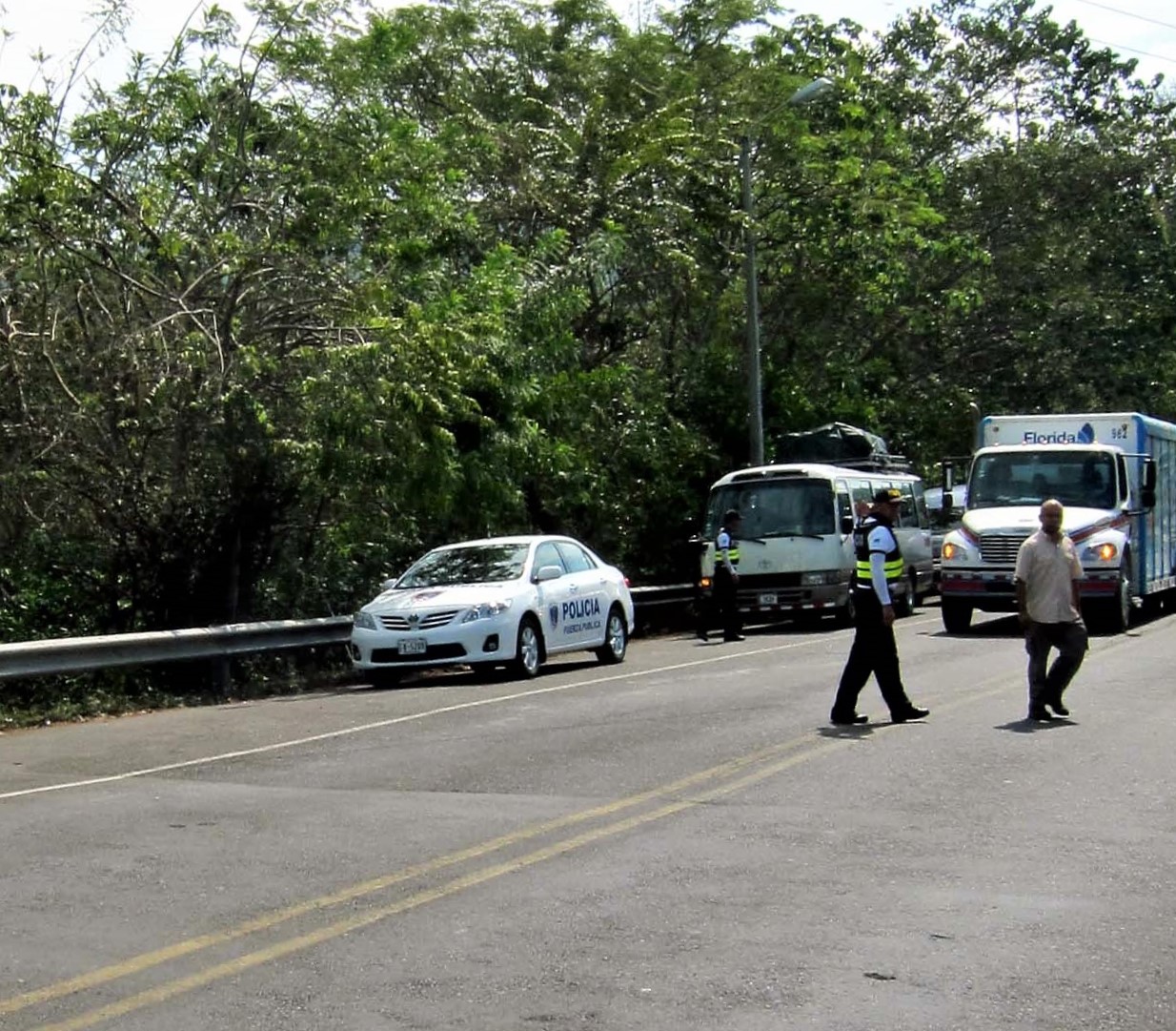 Police stopping traffic, Tarcoles Crocodile Bridge Costa Rica