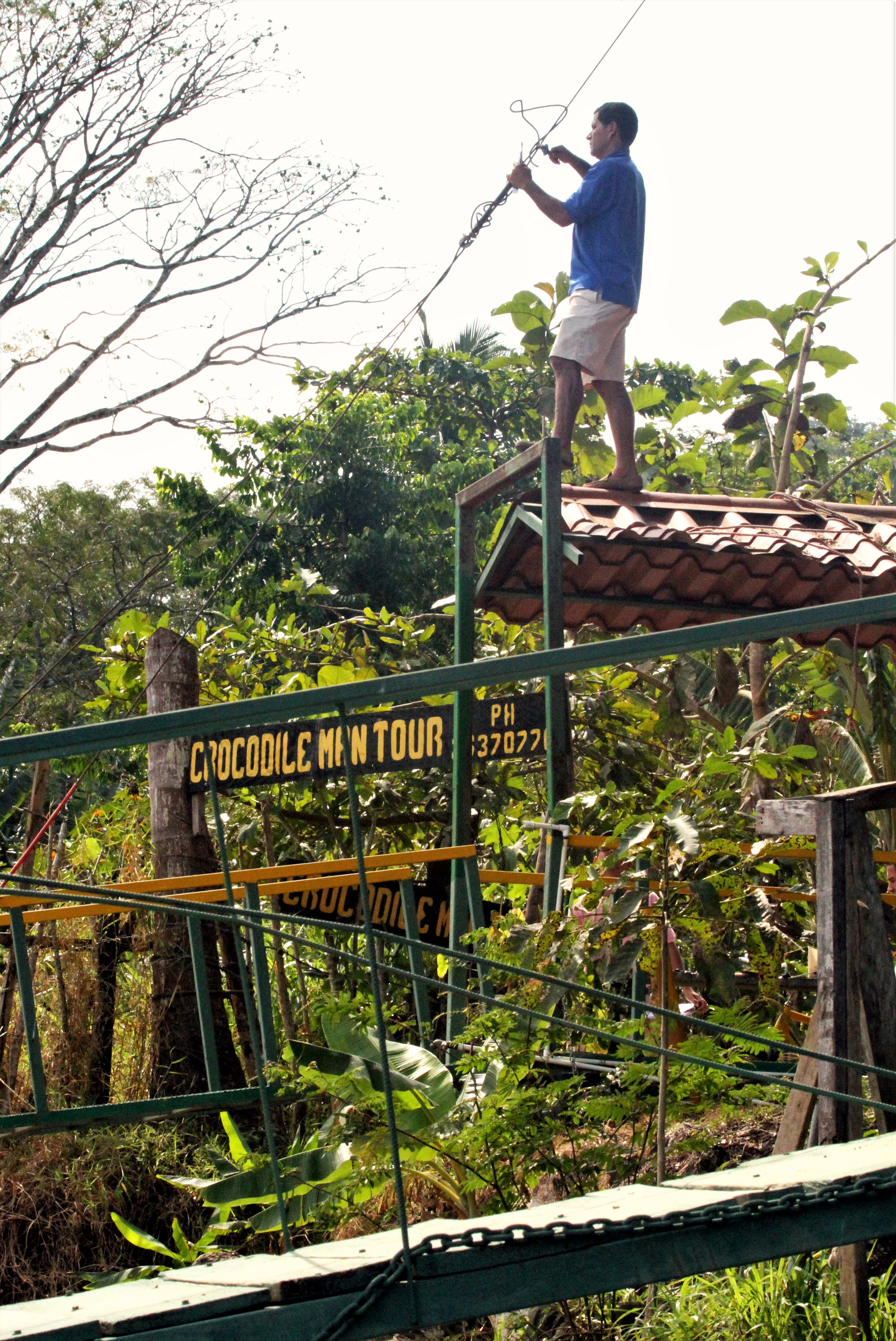 Man working on jetty Rio Tarcoles, Costa Rica